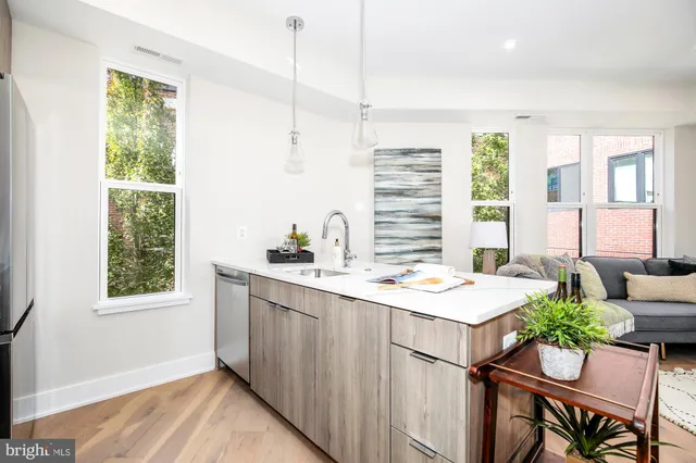 a kitchen with a sink stove and microwave