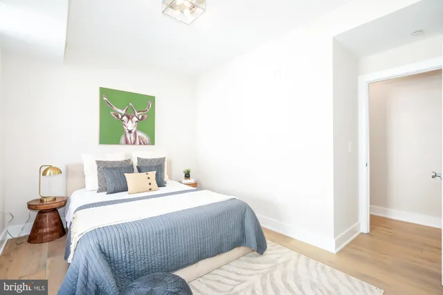 a bedroom with a bed and a table