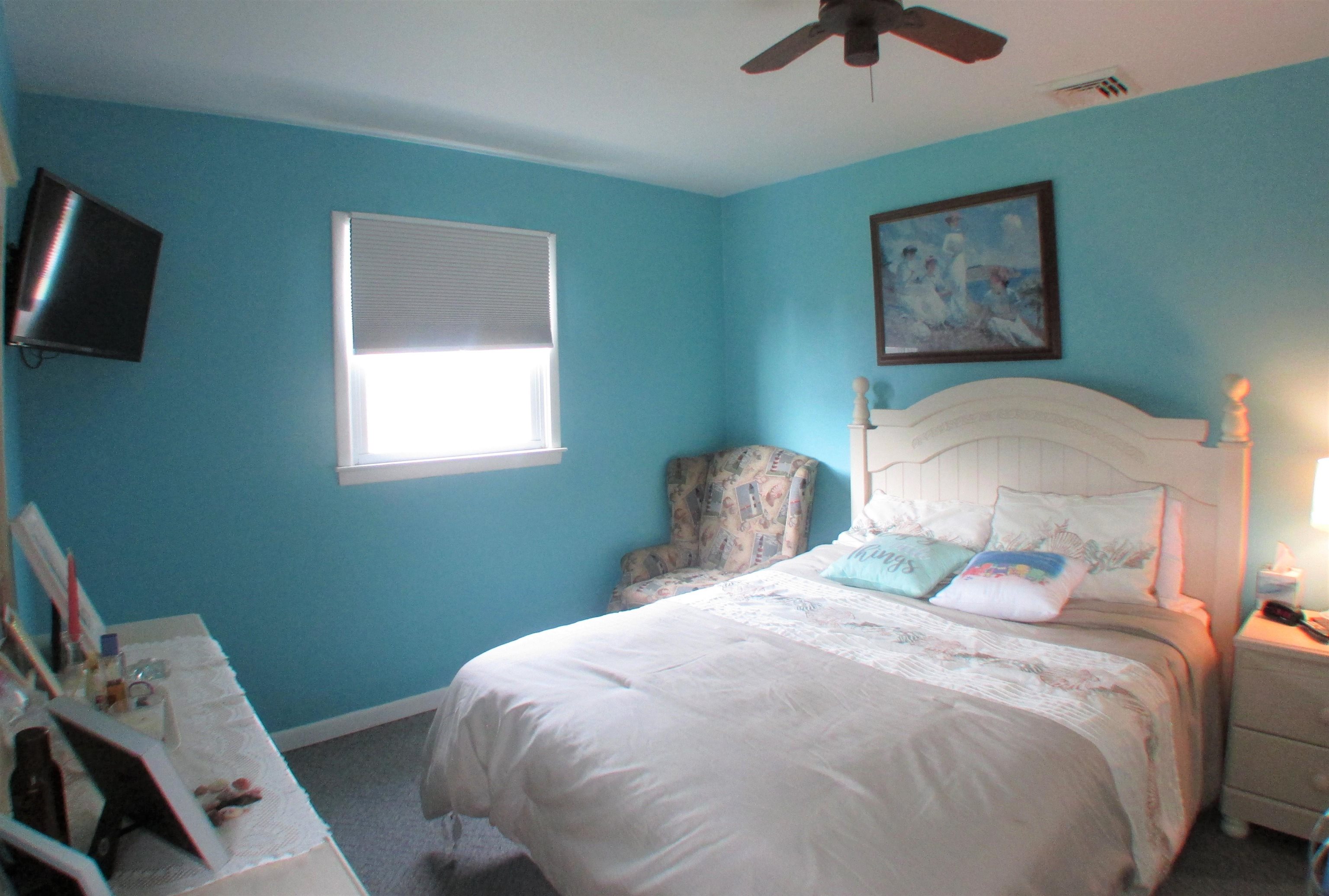 101 Kenvil Road North Cape May, NJ 08204 - Photo 13 of 27 a bedroom with a bed and a window
