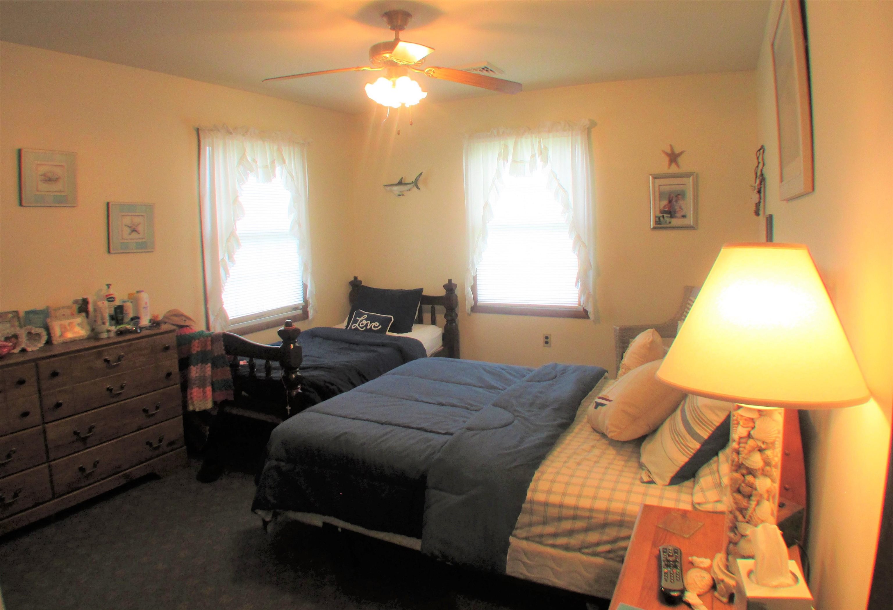 101 Kenvil Road North Cape May, NJ 08204 - Photo 14 of 27 a bedroom with a bed and a window