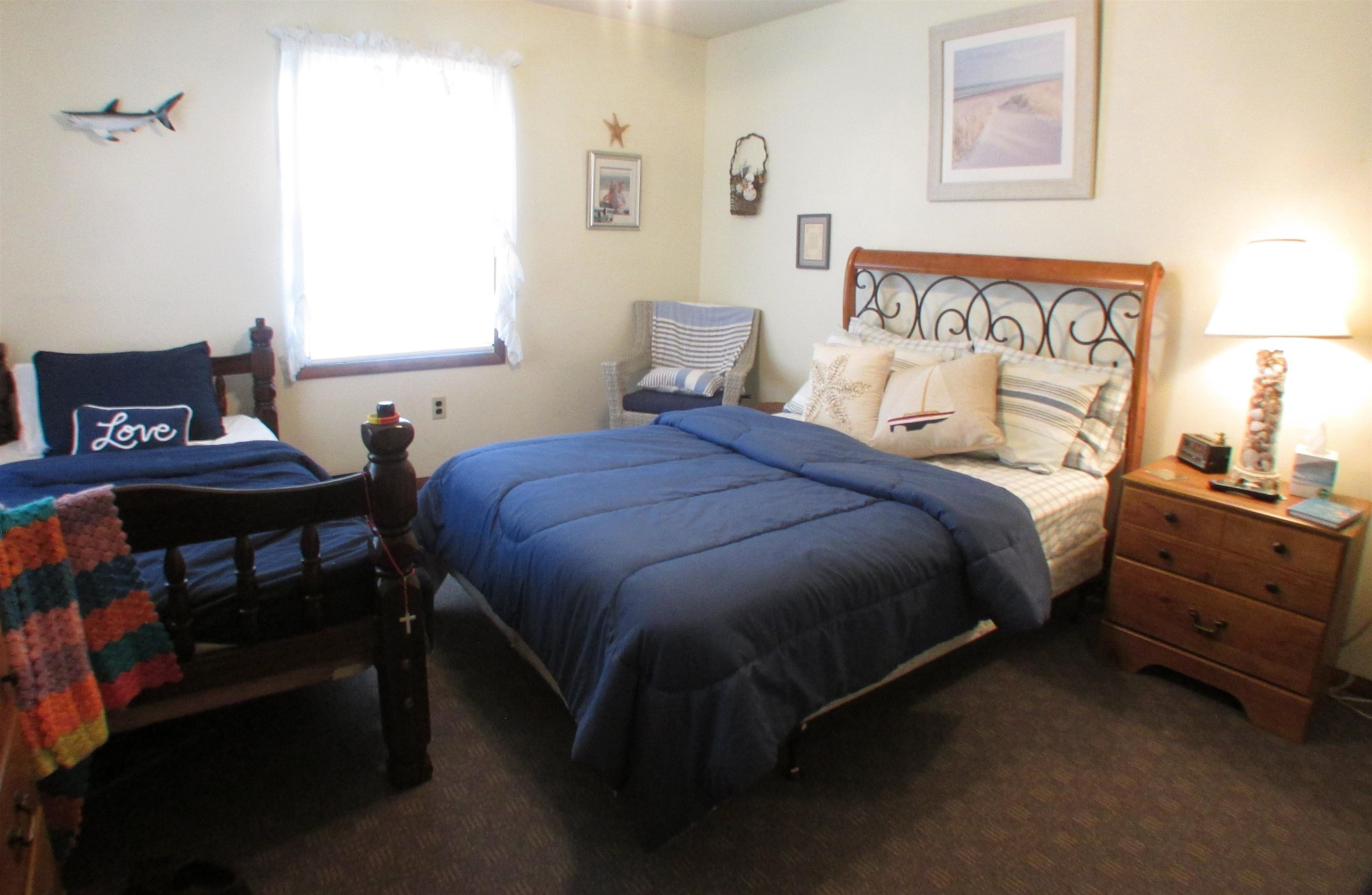 101 Kenvil Road North Cape May, NJ 08204 - Photo 15 of 27 a bedroom with a bed and a lamp on the dresser