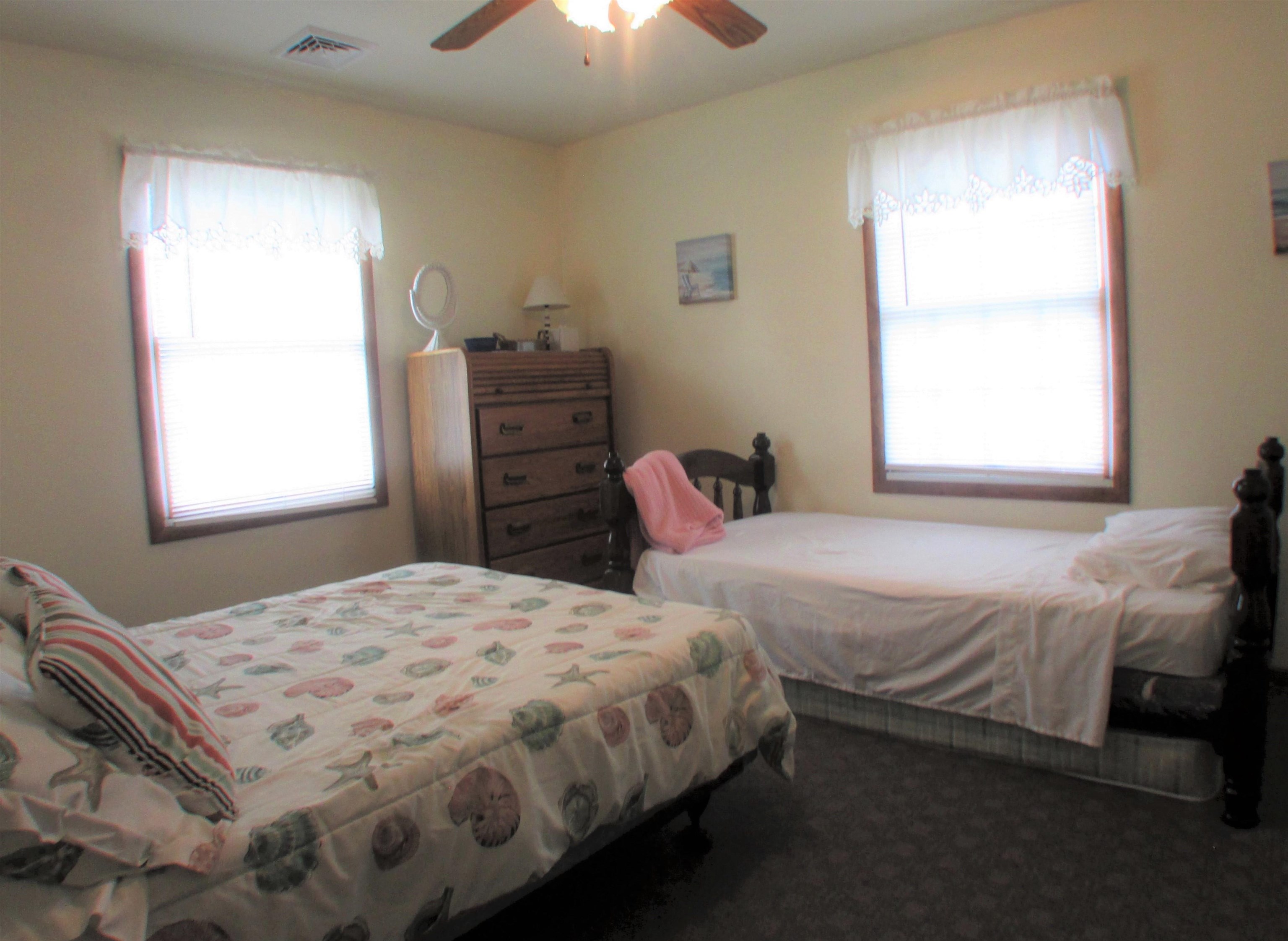 101 Kenvil Road North Cape May, NJ 08204 - Photo 17 of 27 a bedroom with a bed and a window
