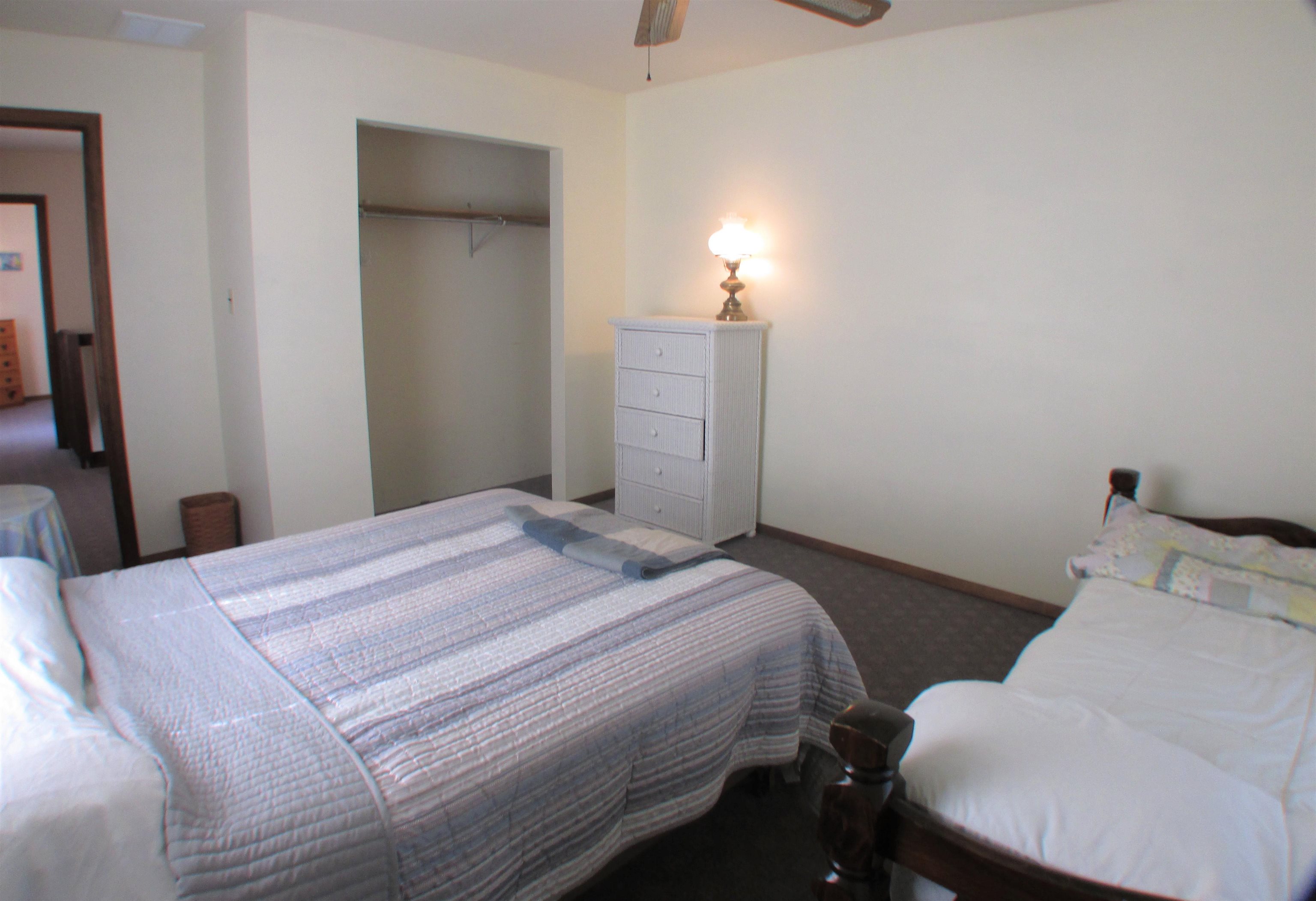 101 Kenvil Road North Cape May, NJ 08204 - Photo 19 of 27 a bedroom with a bed and a mirror