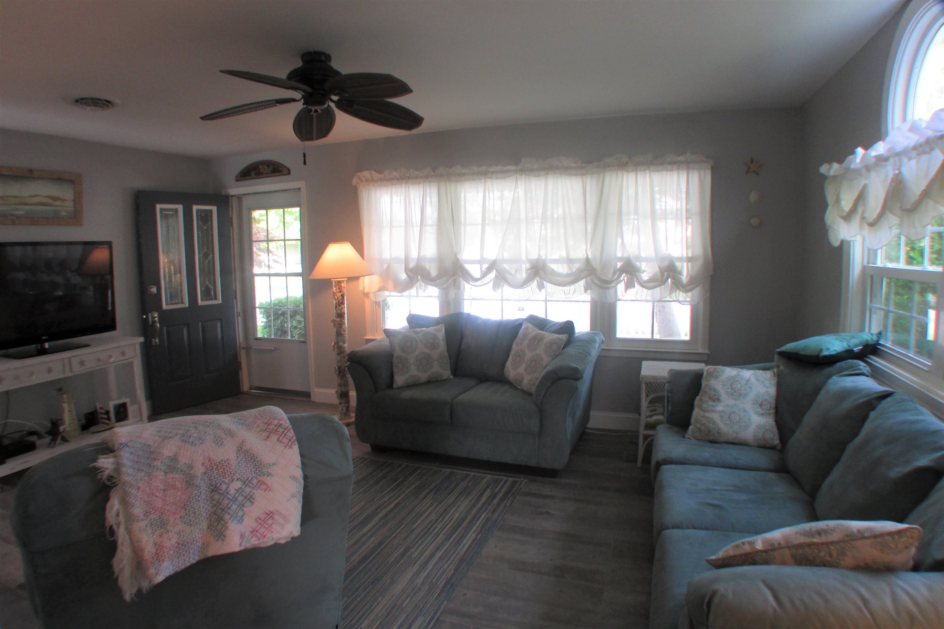 101 Kenvil Road North Cape May, NJ 08204 - Photo 3 of 27 a living room with furniture and a flat screen tv
