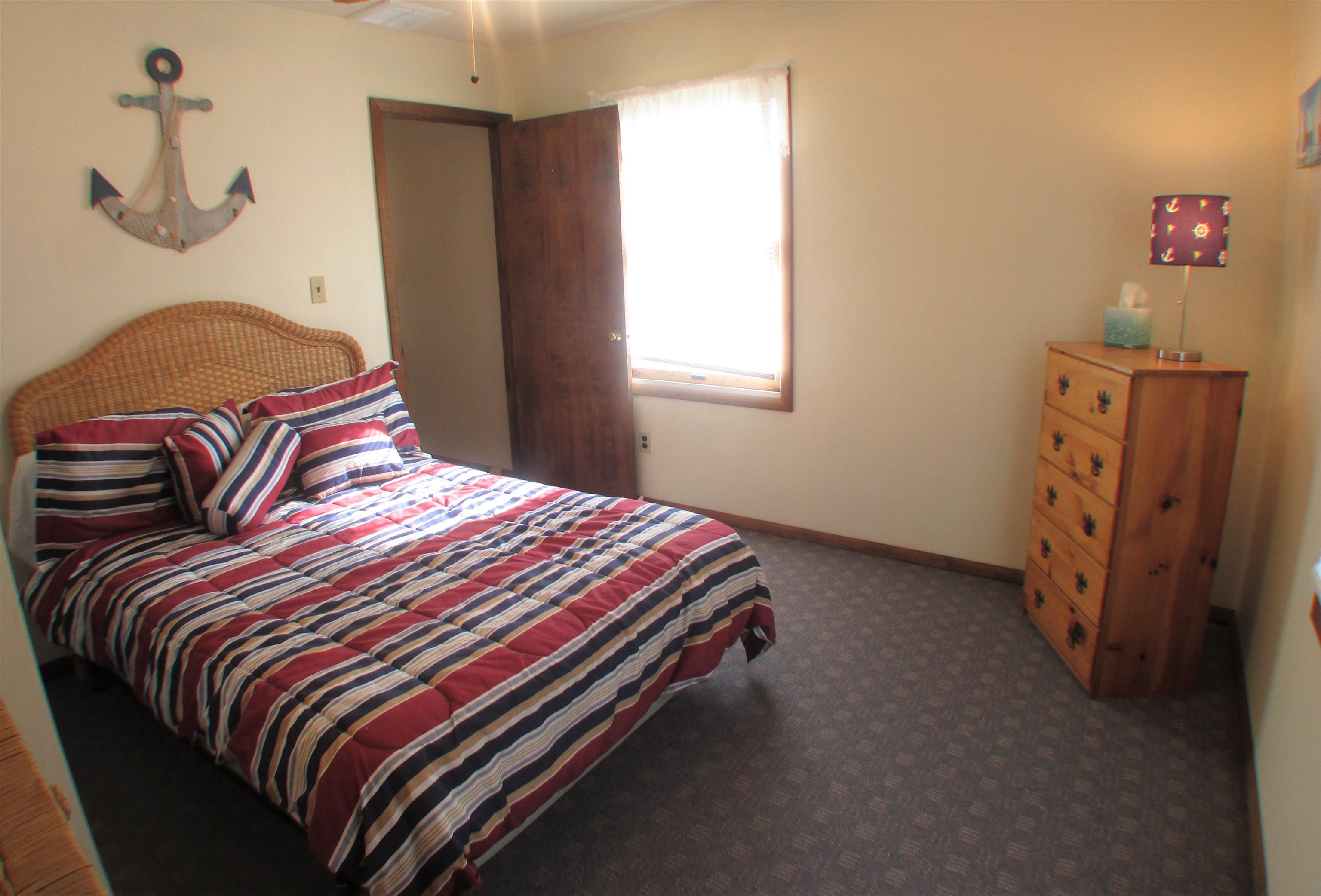 101 Kenvil Road North Cape May, NJ 08204 - Photo 21 of 27 a bedroom with a bed and window