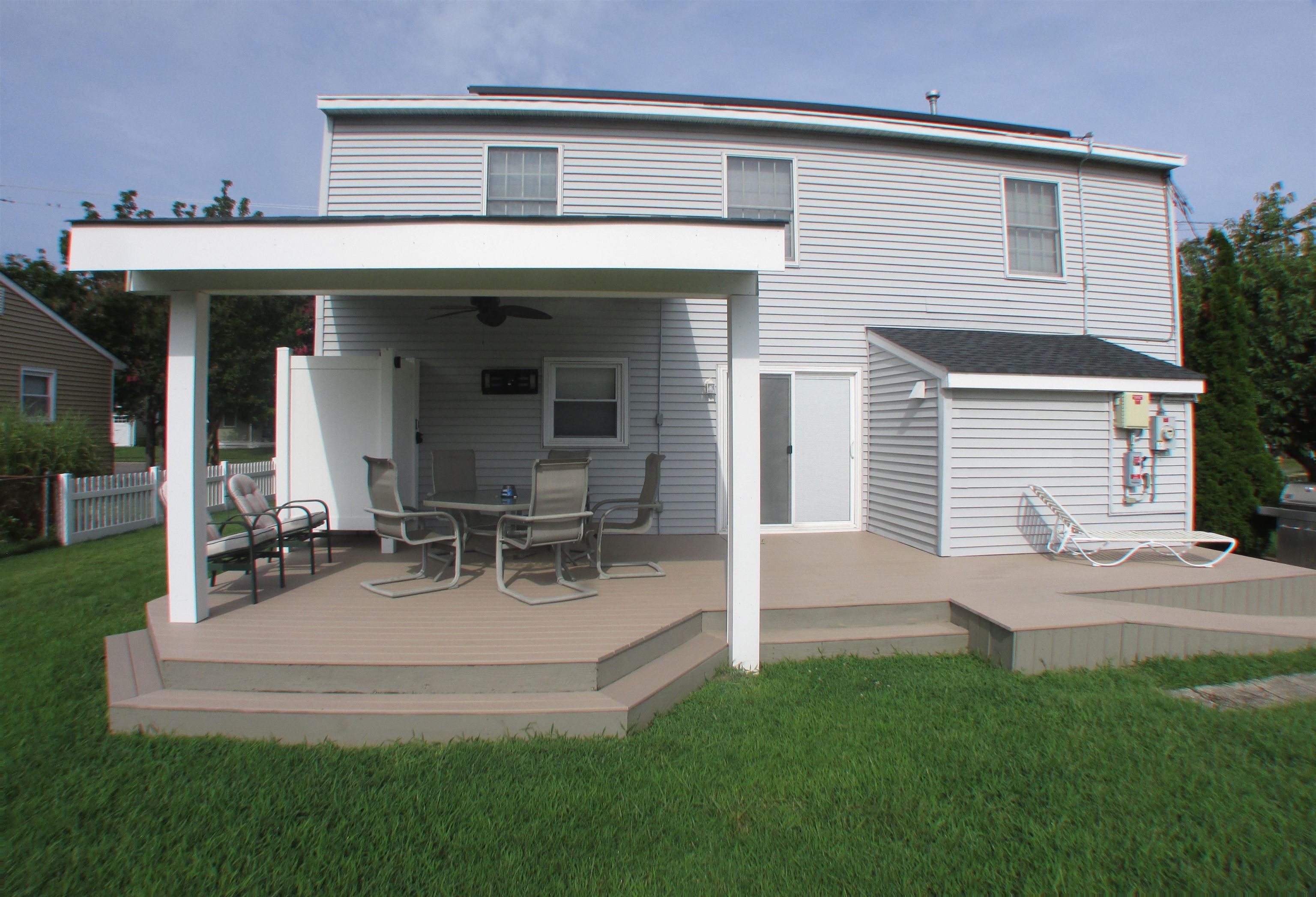 101 Kenvil Road North Cape May, NJ 08204 - Photo 26 of 27 a view of a house with patio and a yard
