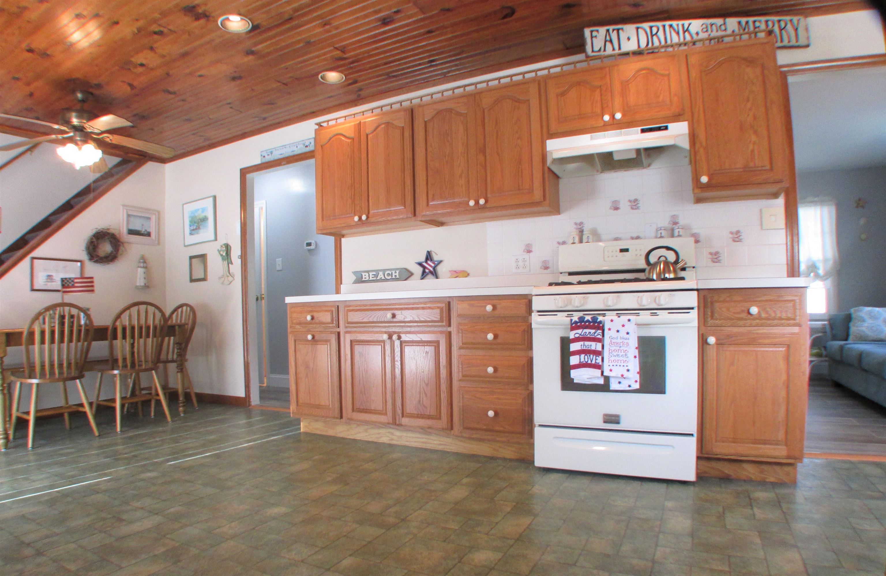 101 Kenvil Road North Cape May, NJ 08204 - Photo 5 of 27 a kitchen with stainless steel appliances granite countertop a stove a sink and a refrigerator