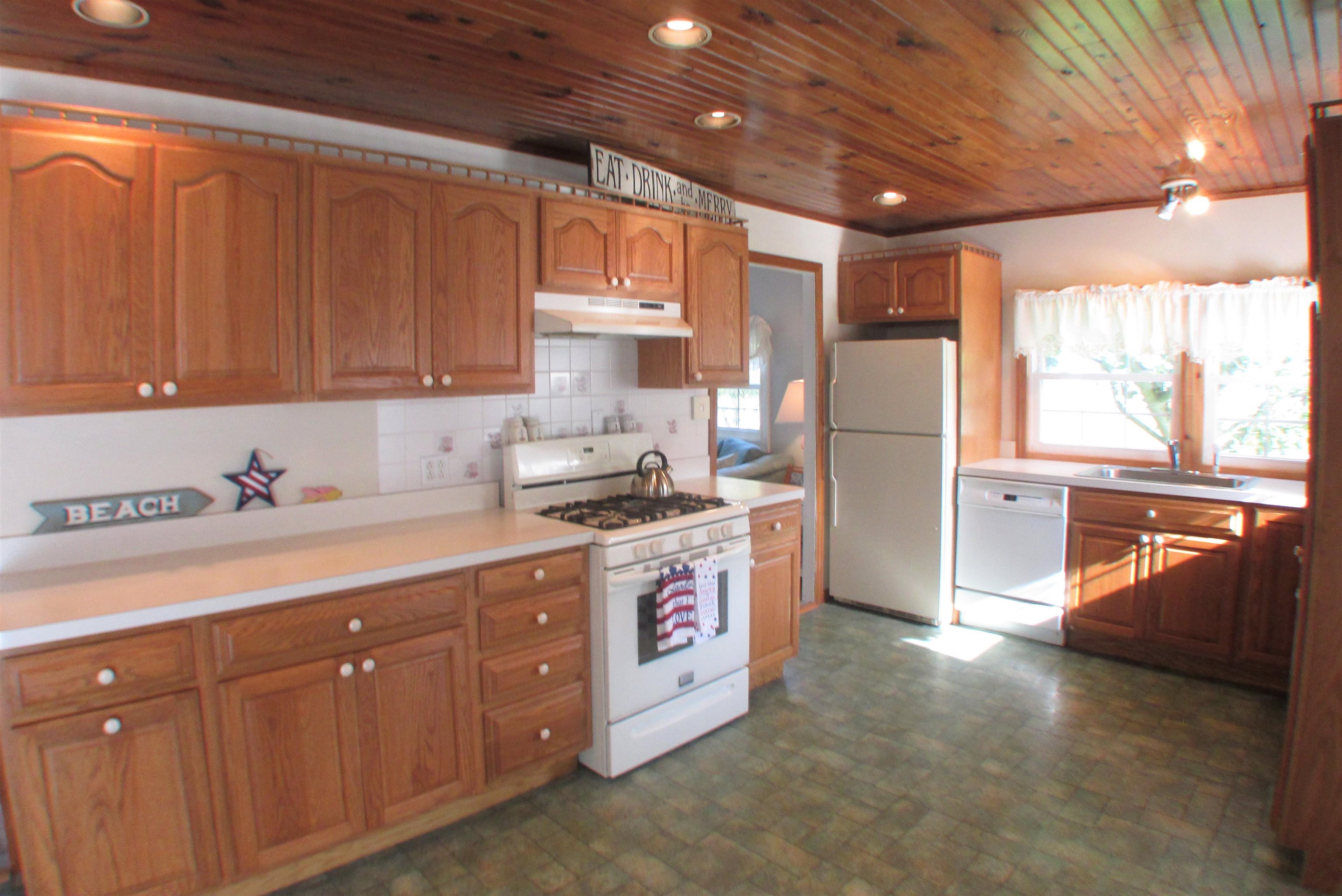 101 Kenvil Road North Cape May, NJ 08204 - Photo 6 of 27 a kitchen with stainless steel appliances granite countertop a sink a stove and a refrigerator