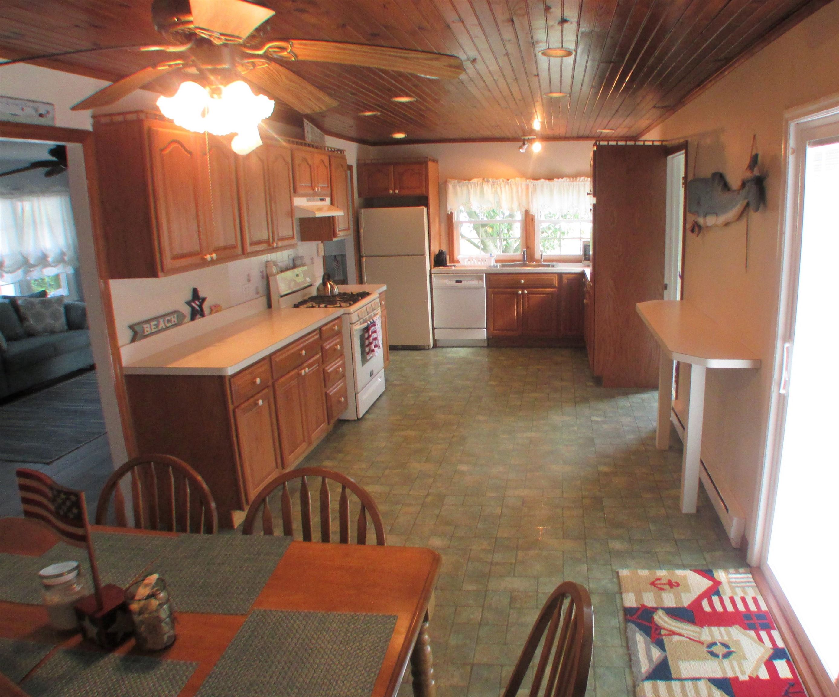 101 Kenvil Road North Cape May, NJ 08204 - Photo 8 of 27 a kitchen with refrigerator and window
