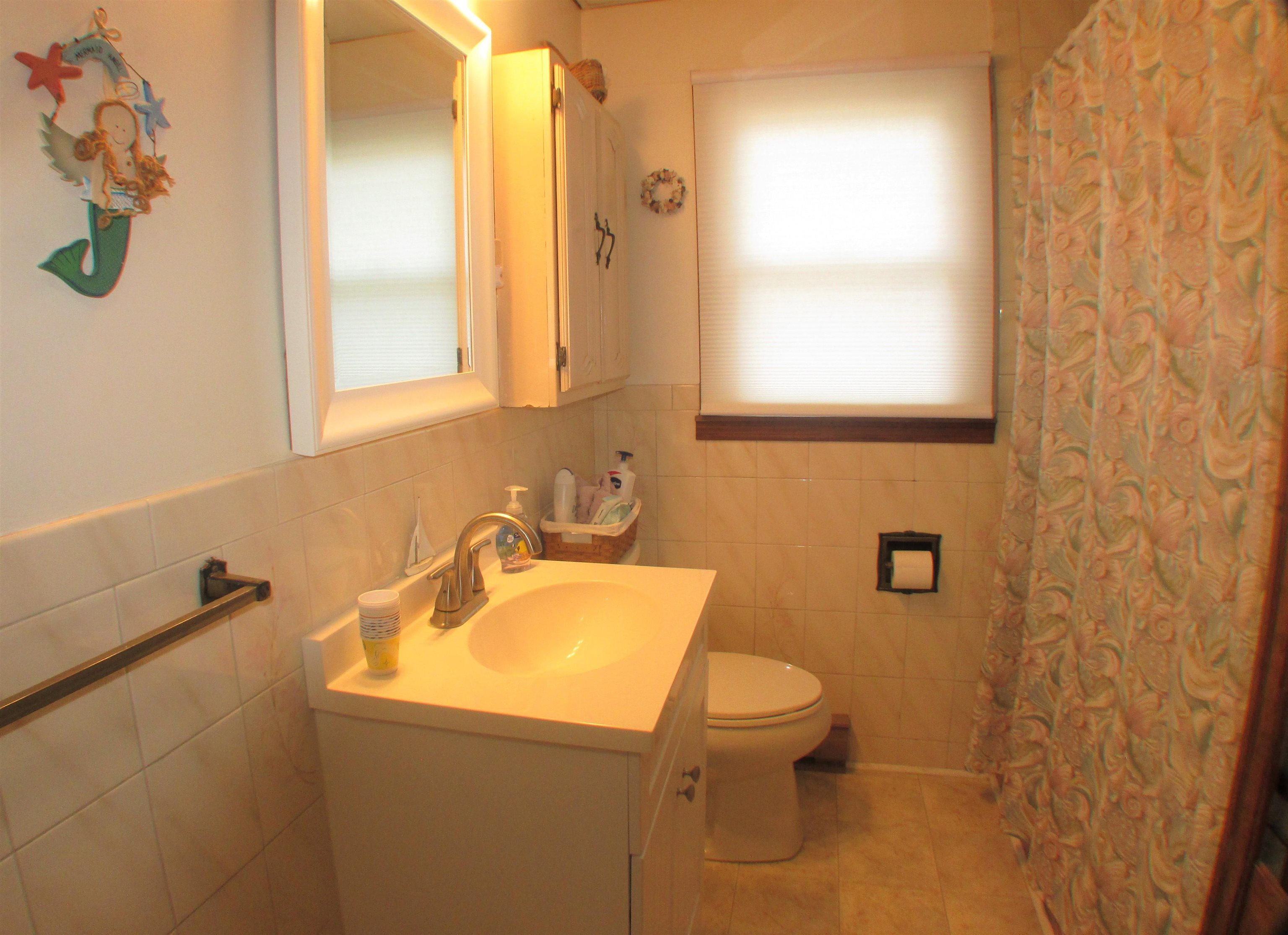 101 Kenvil Road North Cape May, NJ 08204 - Photo 9 of 27 a bathroom with a sink and a toilet
