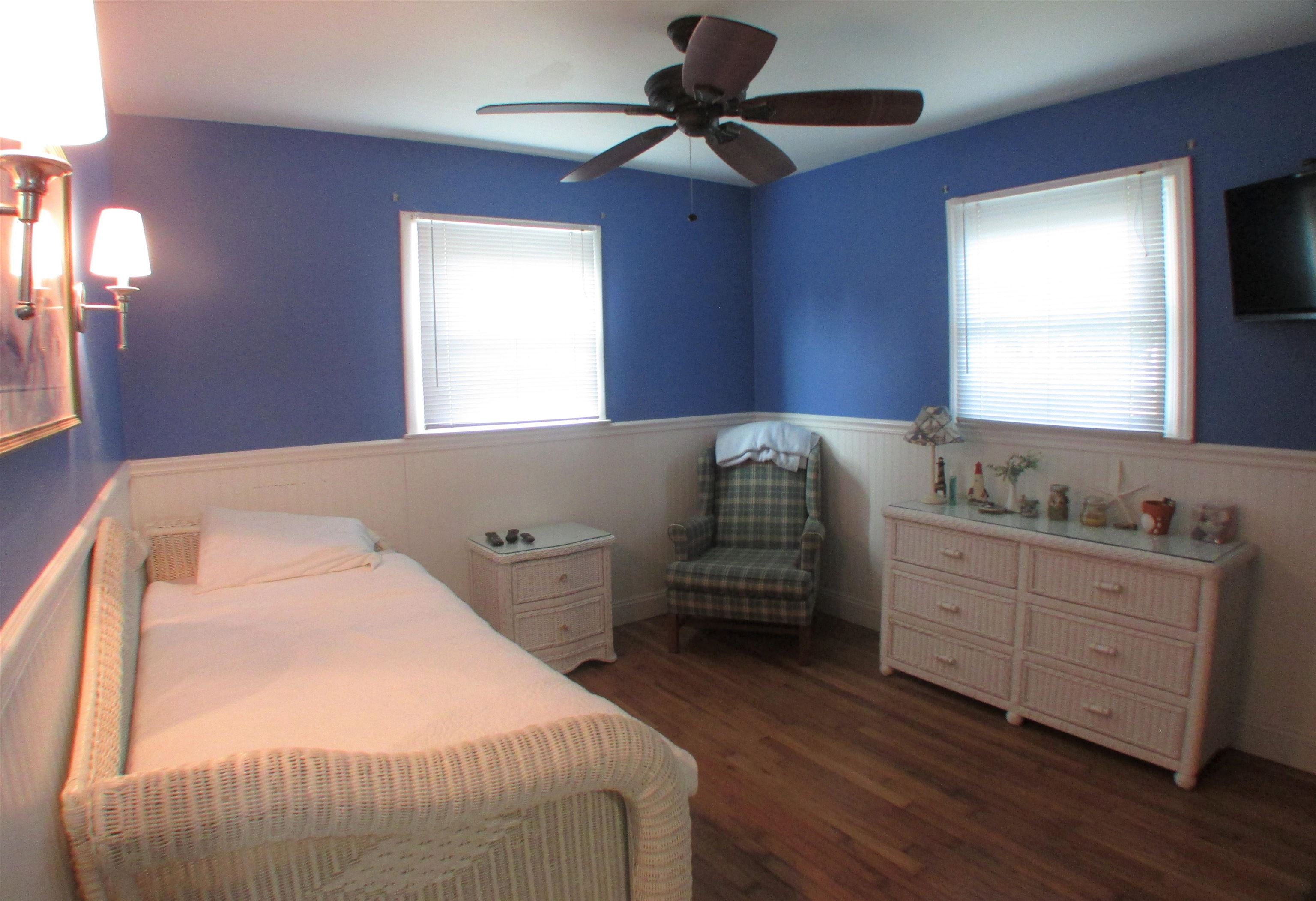 101 Kenvil Road North Cape May, NJ 08204 - Photo 10 of 27 a bedroom with a bed and a dresser