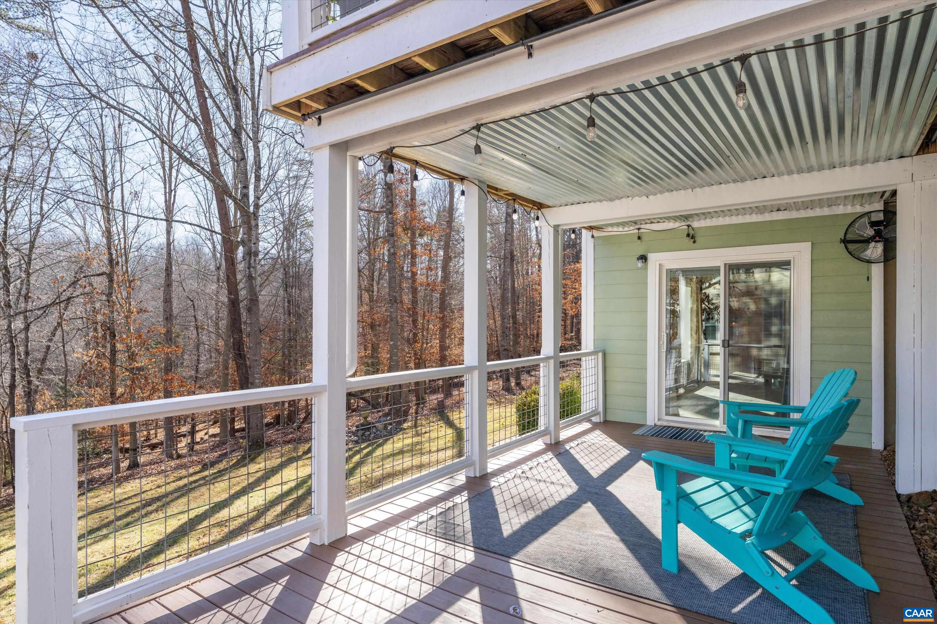 9 Vine Ridge Drive Palmyra, VA 22963 - Photo 68 of 72 a porch with chairs and wooden floor