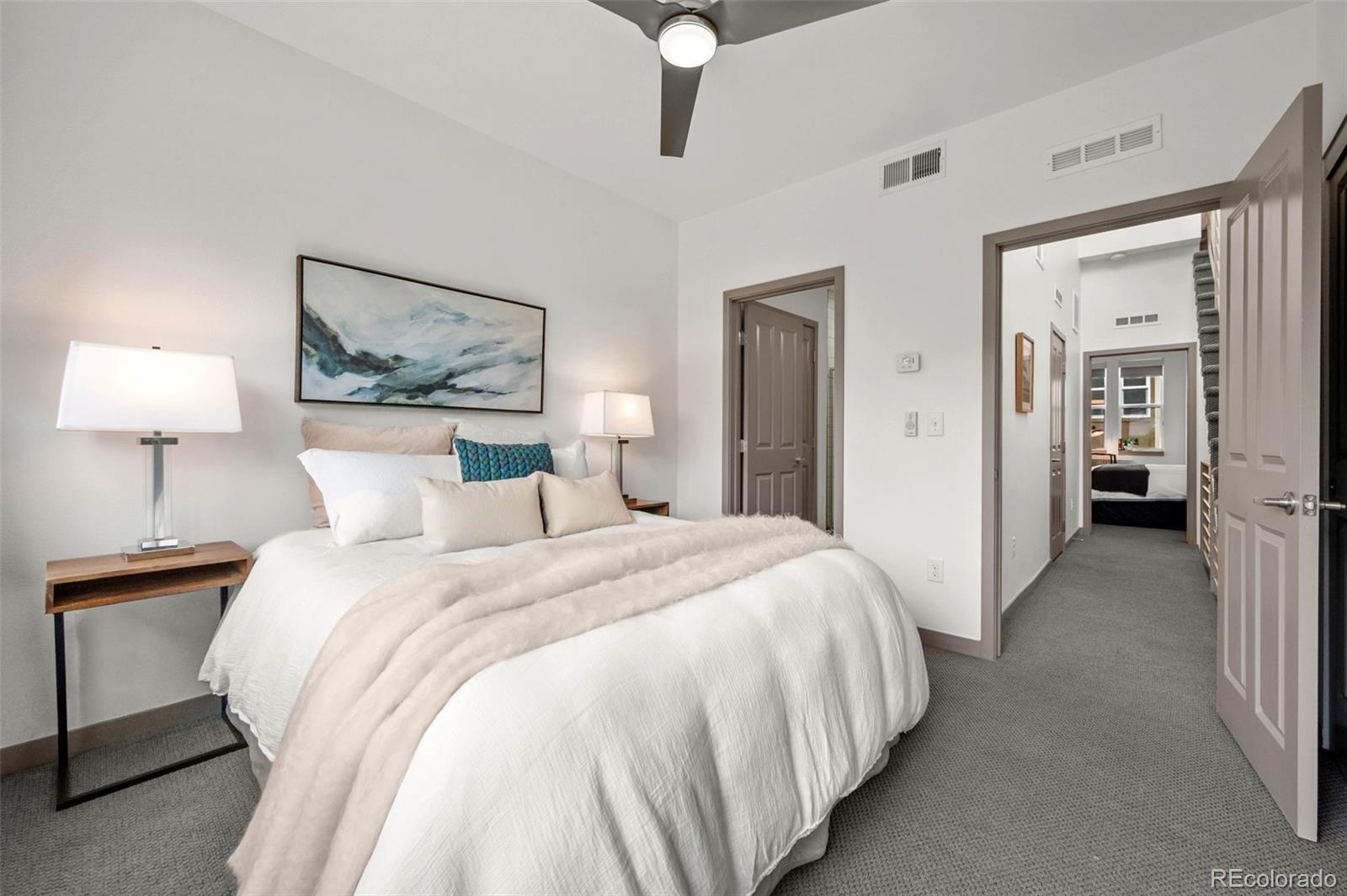 2200 Tremont Place, Unit 5 Denver, CO 80205 - Photo 17 of 22 a bedroom with bed and window