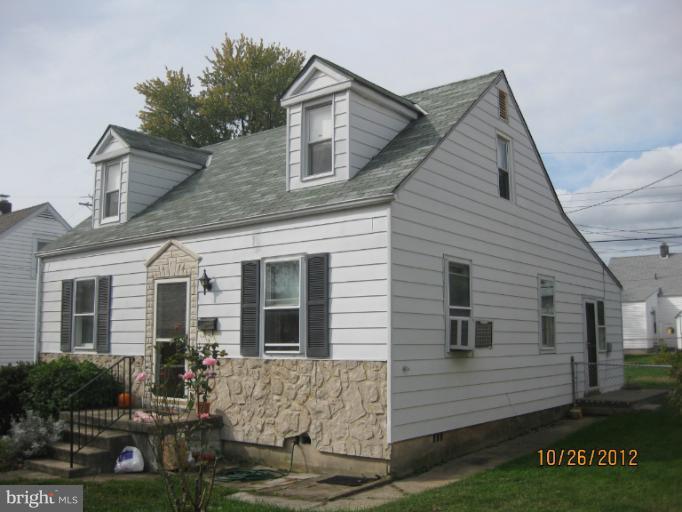 5 Fairway Road Baltimore, MD 21221 - Photo 1 of 10 a front view of a house with garden