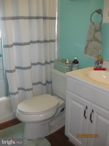 5 Fairway Road Baltimore, MD 21221 - Photo 3 of 10 a bathroom with a toilet and a sink