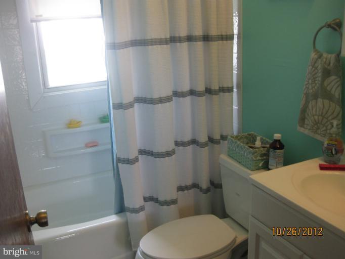 5 Fairway Road Baltimore, MD 21221 - Photo 4 of 10 a bathroom with a sink toilet and shower