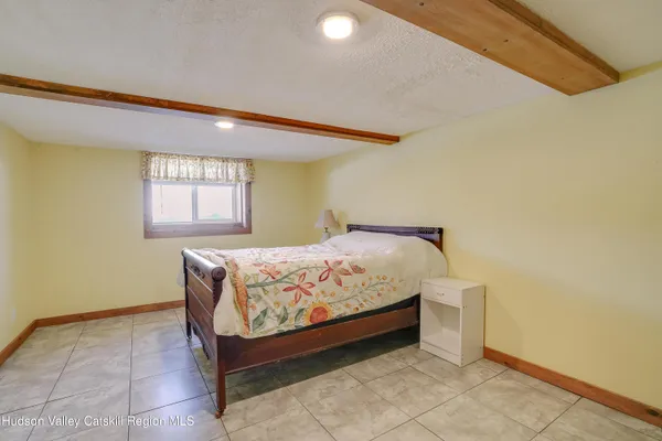 a bed sitting in a room next to a window