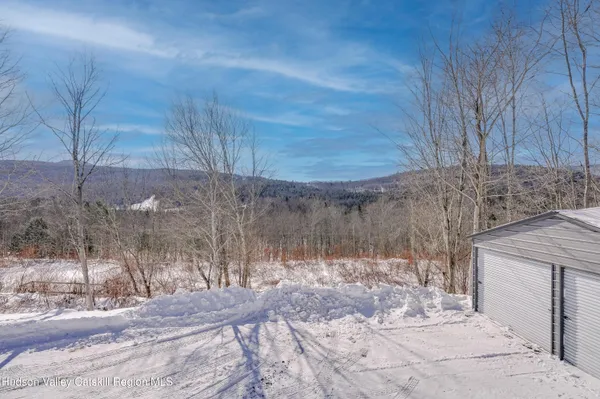 a view of a yard covered in snow