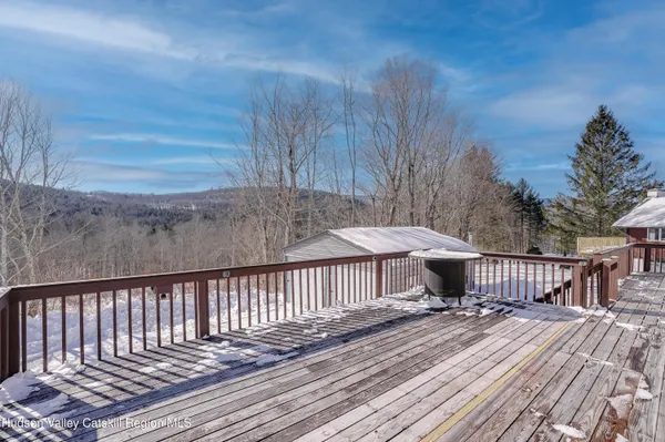a view of a wooden deck with a patio