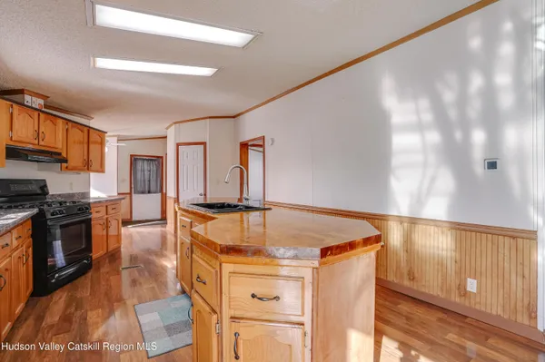 a kitchen with stainless steel appliances granite countertop a stove and a refrigerator