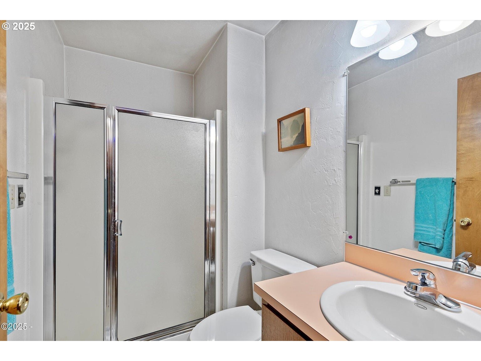 507 Northwest Alpine Street, Unit 204 Newport, OR 97365 - Photo 13 of 30 a bathroom with a sink and a mirror