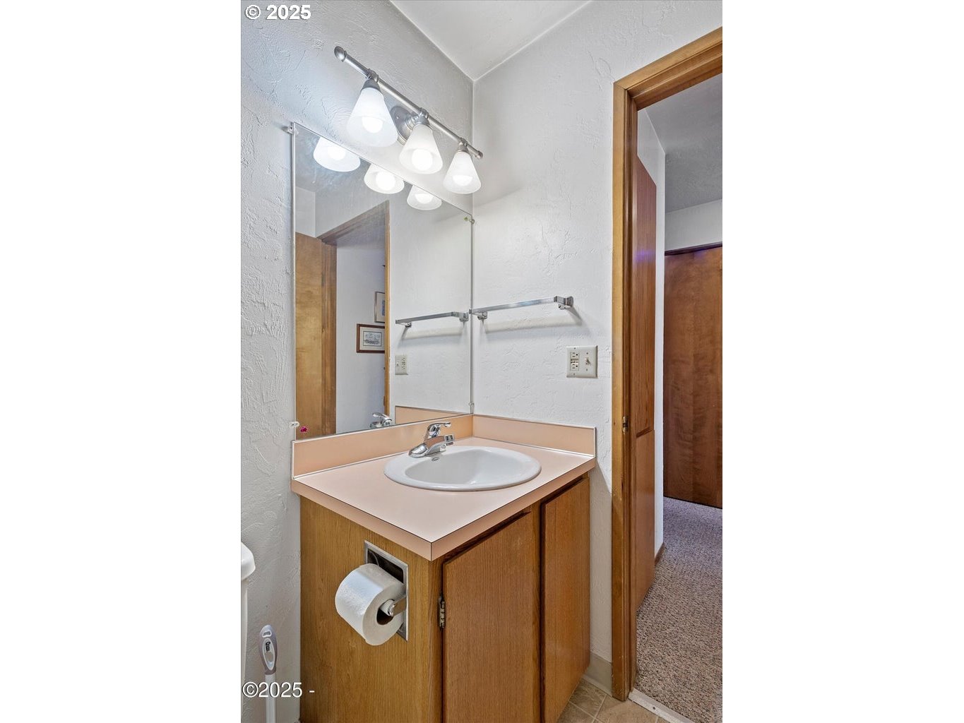 507 Northwest Alpine Street, Unit 204 Newport, OR 97365 - Photo 15 of 30 a bathroom with a sink and a mirror
