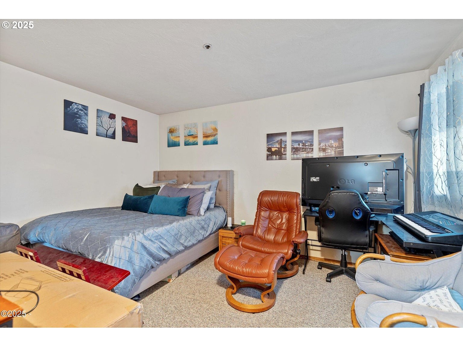507 Northwest Alpine Street, Unit 204 Newport, OR 97365 - Photo 16 of 30 a bedroom with furniture and a couch