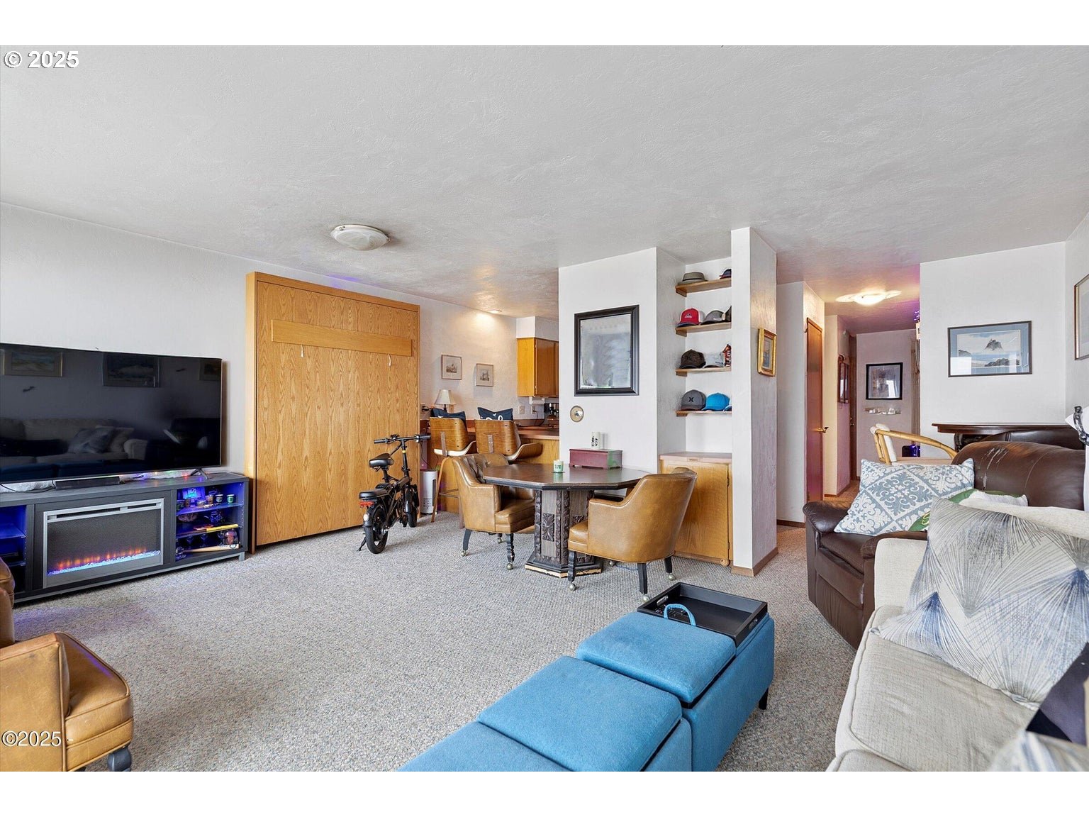 507 Northwest Alpine Street, Unit 204 Newport, OR 97365 - Photo 3 of 30 a living room with furniture and a flat screen tv