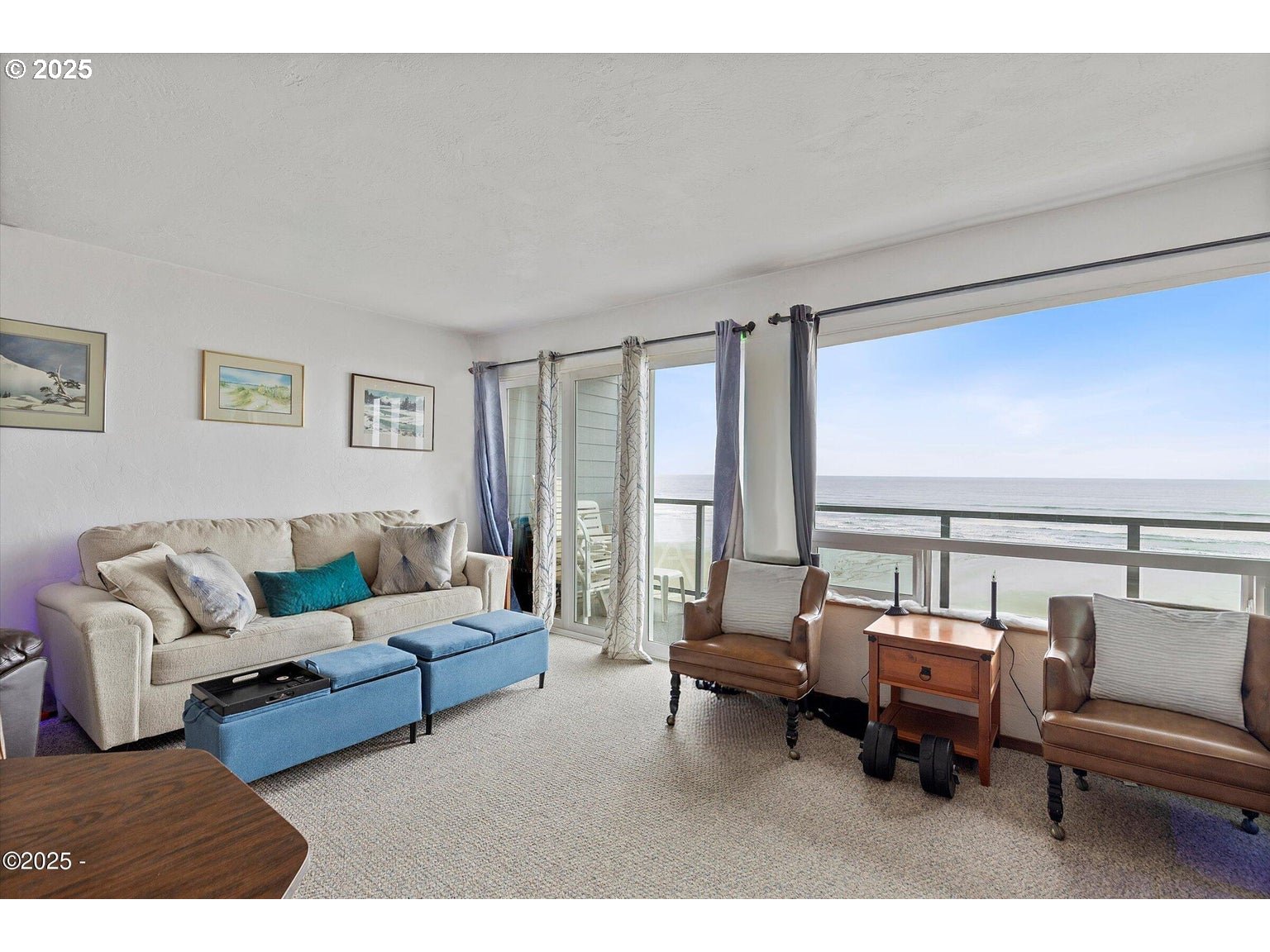 507 Northwest Alpine Street, Unit 204 Newport, OR 97365 - Photo 5 of 30 a living room with furniture and large windows