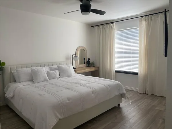 a bedroom with a bed and a window in it