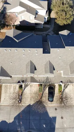 an aerial view of a house with outdoor space