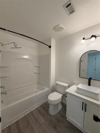a bathroom with a sink a toilet and a bathtub