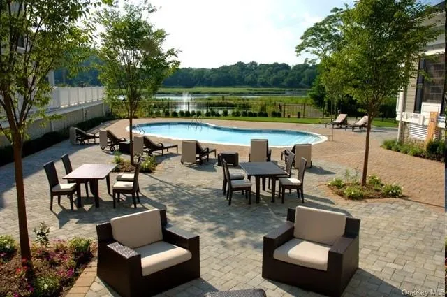 a view of a patio with couches table and chairs