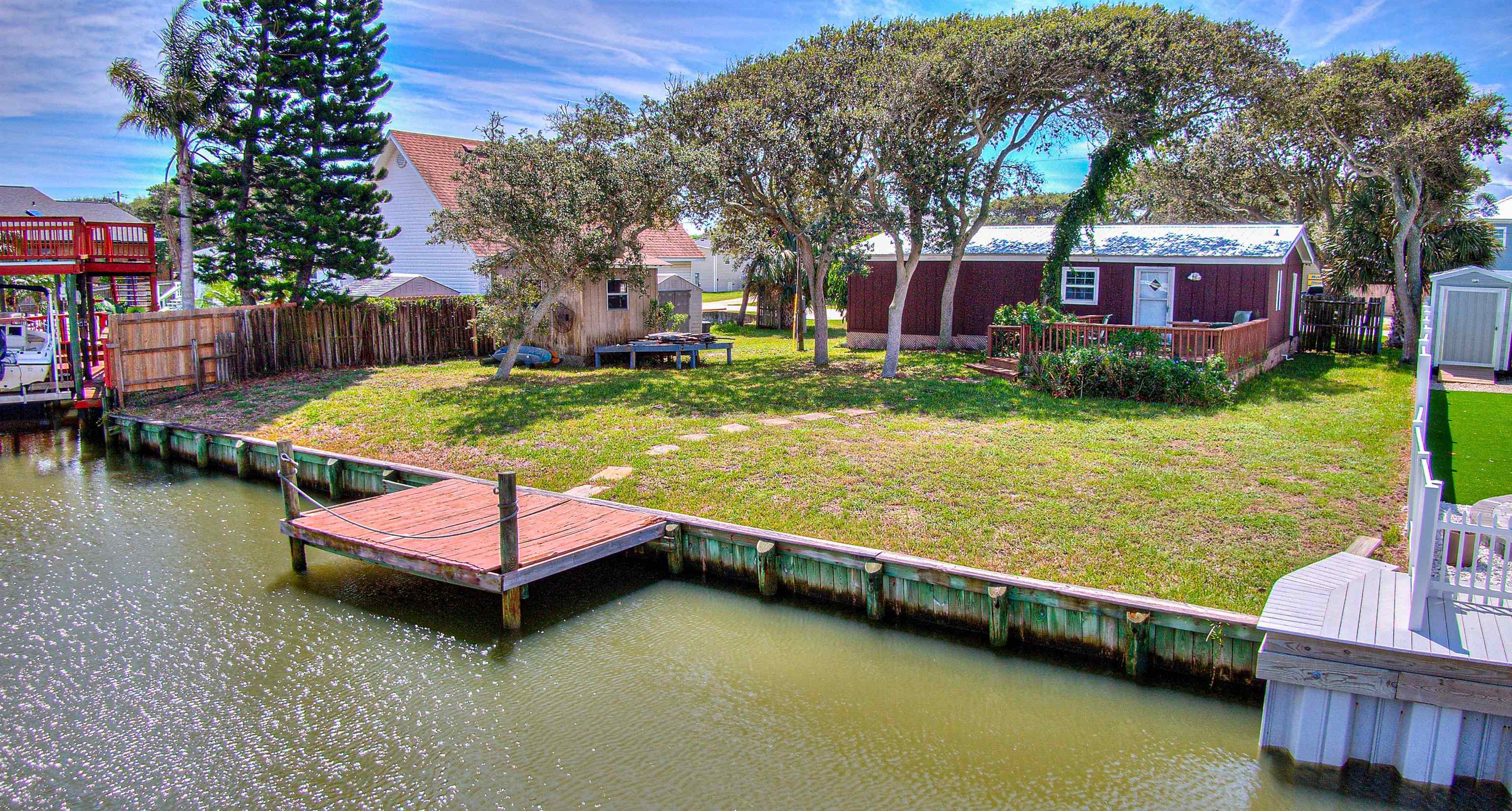 212 Ventura Road St. Augustine, FL 32080 - Photo 2 of 17 a swimming pool with outdoor seating and yard