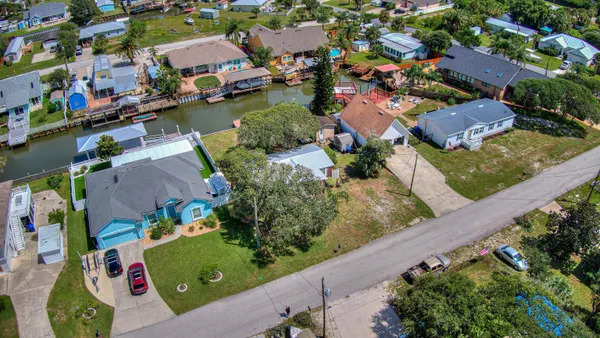 an aerial view of a houses with outdoor space