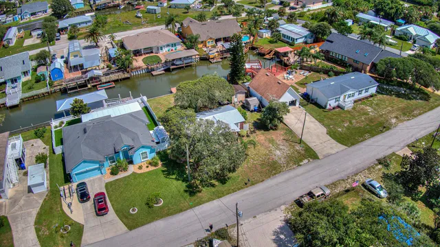an aerial view of a houses with outdoor space