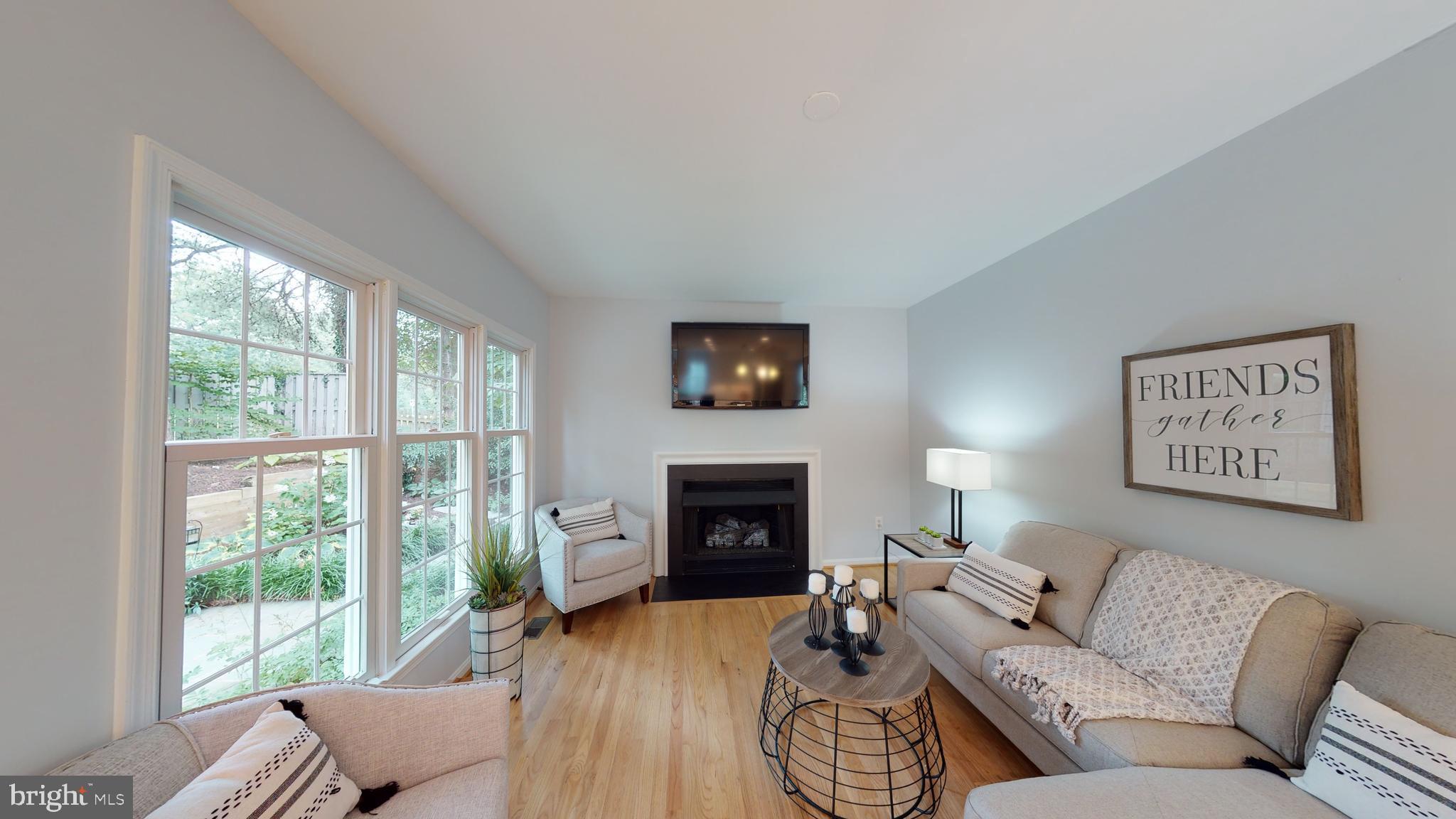 11609 Springhouse Place Reston, VA 20194 - Photo 9 of 41 Family Room with Wall of Windows, Gas Fireplace.