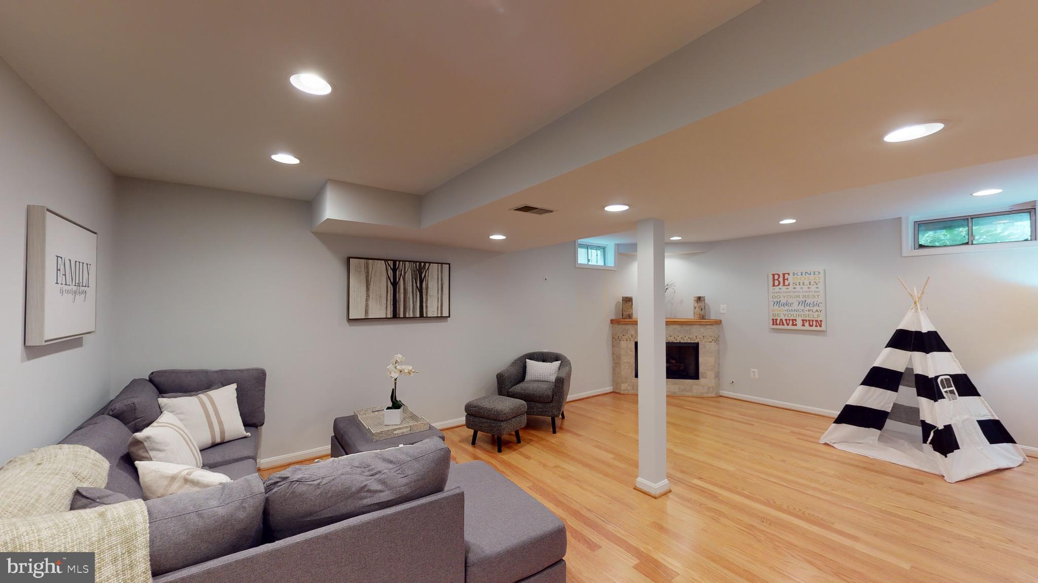 11609 Springhouse Place Reston, VA 20194 - Photo 22 of 41 Lower Level Recreation Room w/Wood Laminate Floors