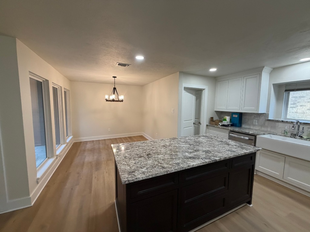 a kitchen with a stove and a sink
