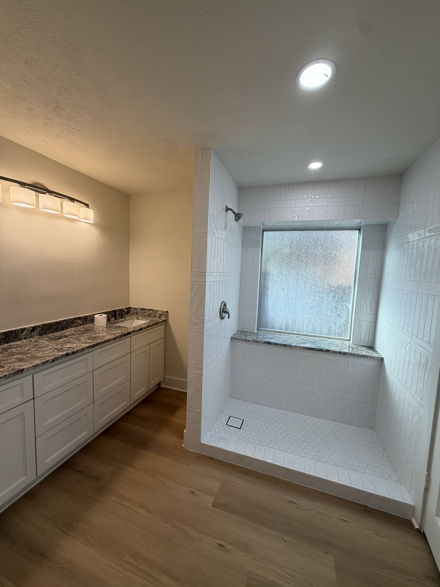 70 Brookflower Road Spring, TX 77380 - Photo 16 of 16 a bathroom with a bathtub and a sink