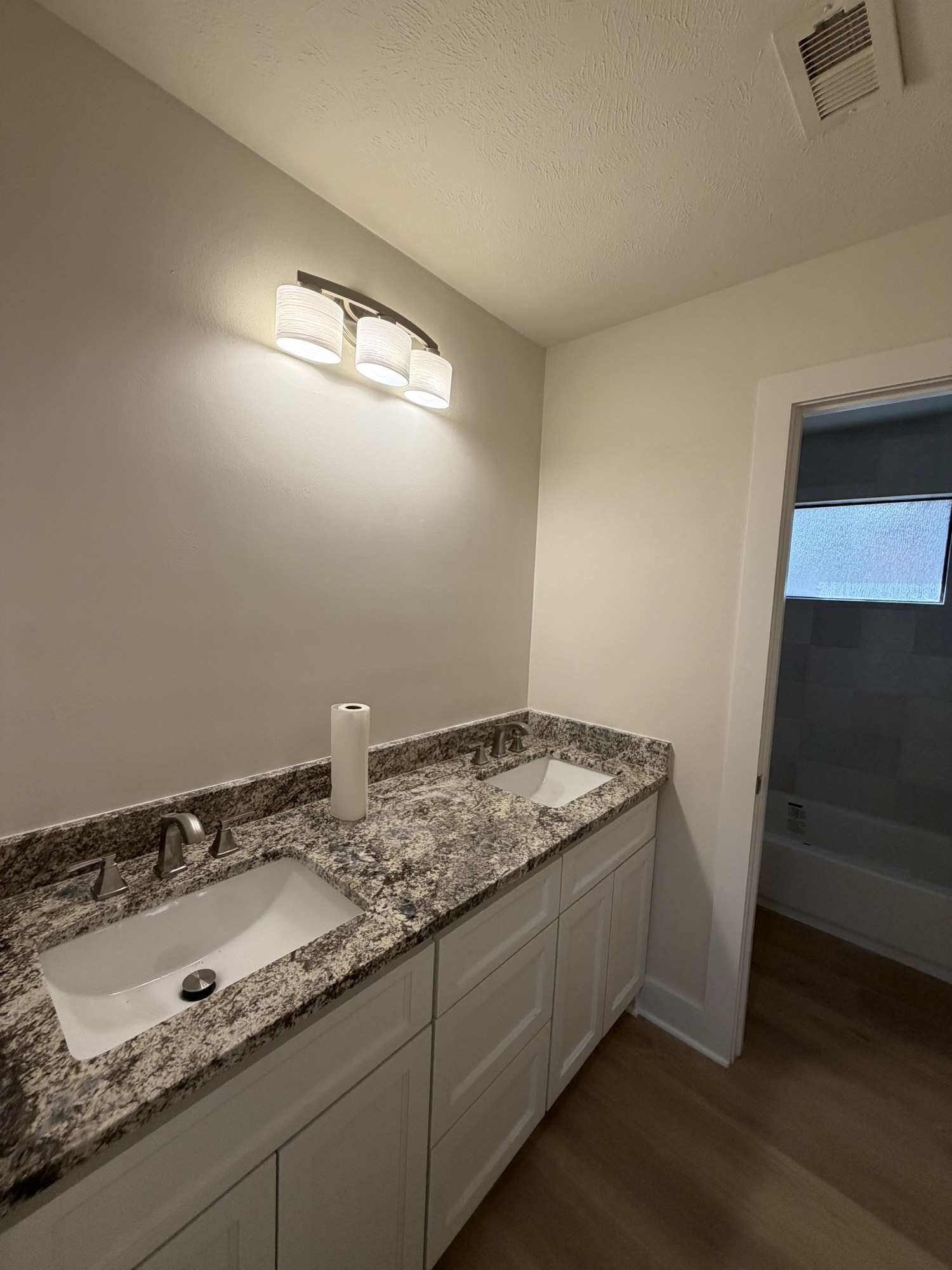 70 Brookflower Road Spring, TX 77380 - Photo 4 of 16 a bathroom with a granite countertop sink and a mirror