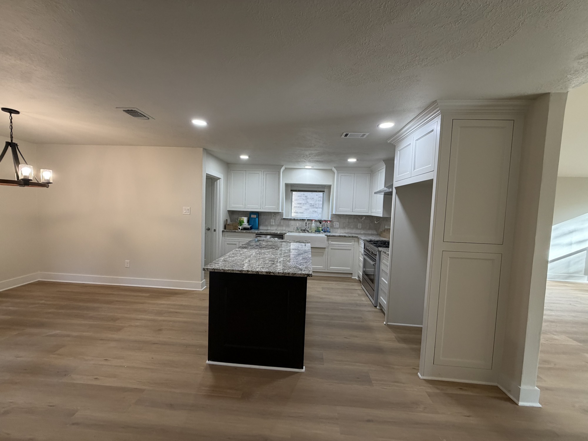 70 Brookflower Road Spring, TX 77380 - Photo 7 of 16 a kitchen with kitchen island stainless steel appliances counter space and a sink