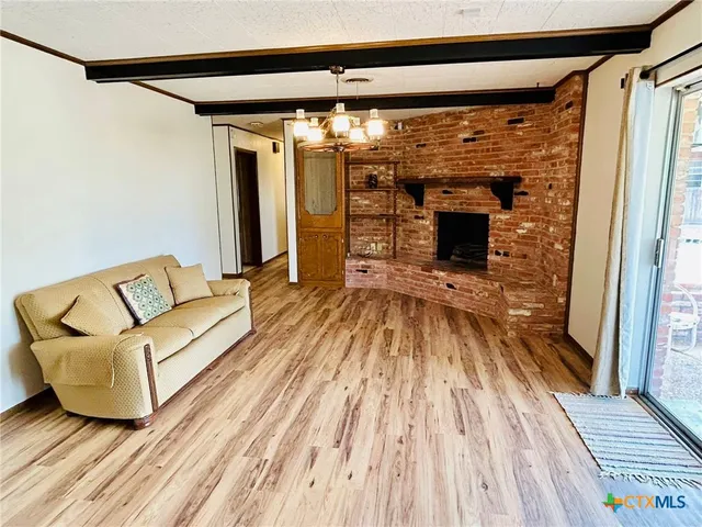 a view of a living room with a wooden floor