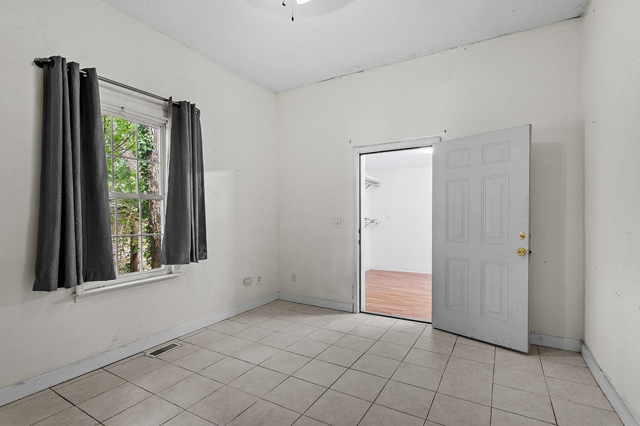 24 Dixie Trail Raleigh, NC 27607 - Photo 18 of 38 an empty room with windows