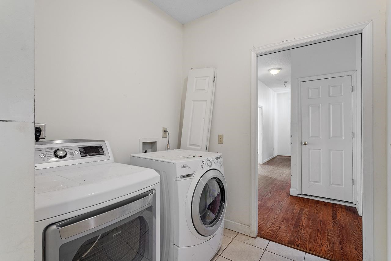 24 Dixie Trail Raleigh, NC 27607 - Photo 25 of 38 a utility room with dryer and washer