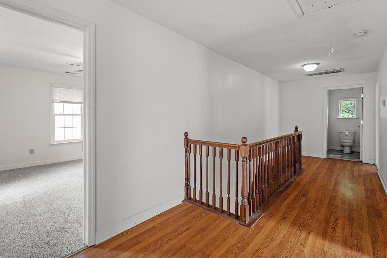 24 Dixie Trail Raleigh, NC 27607 - Photo 27 of 38 a view of a room with wooden floor and windows