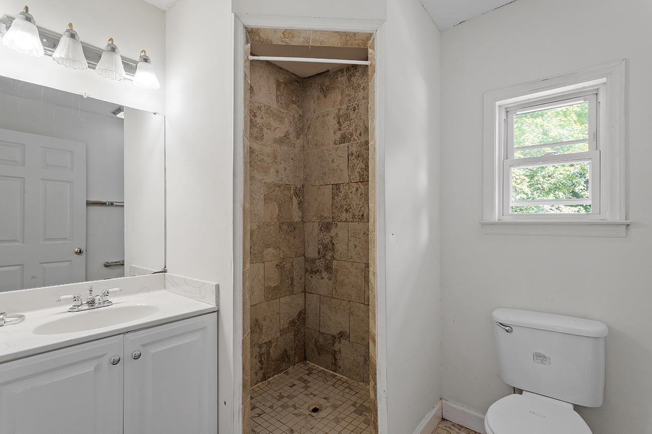 24 Dixie Trail Raleigh, NC 27607 - Photo 28 of 38 a bathroom with a sink a toilet and shower