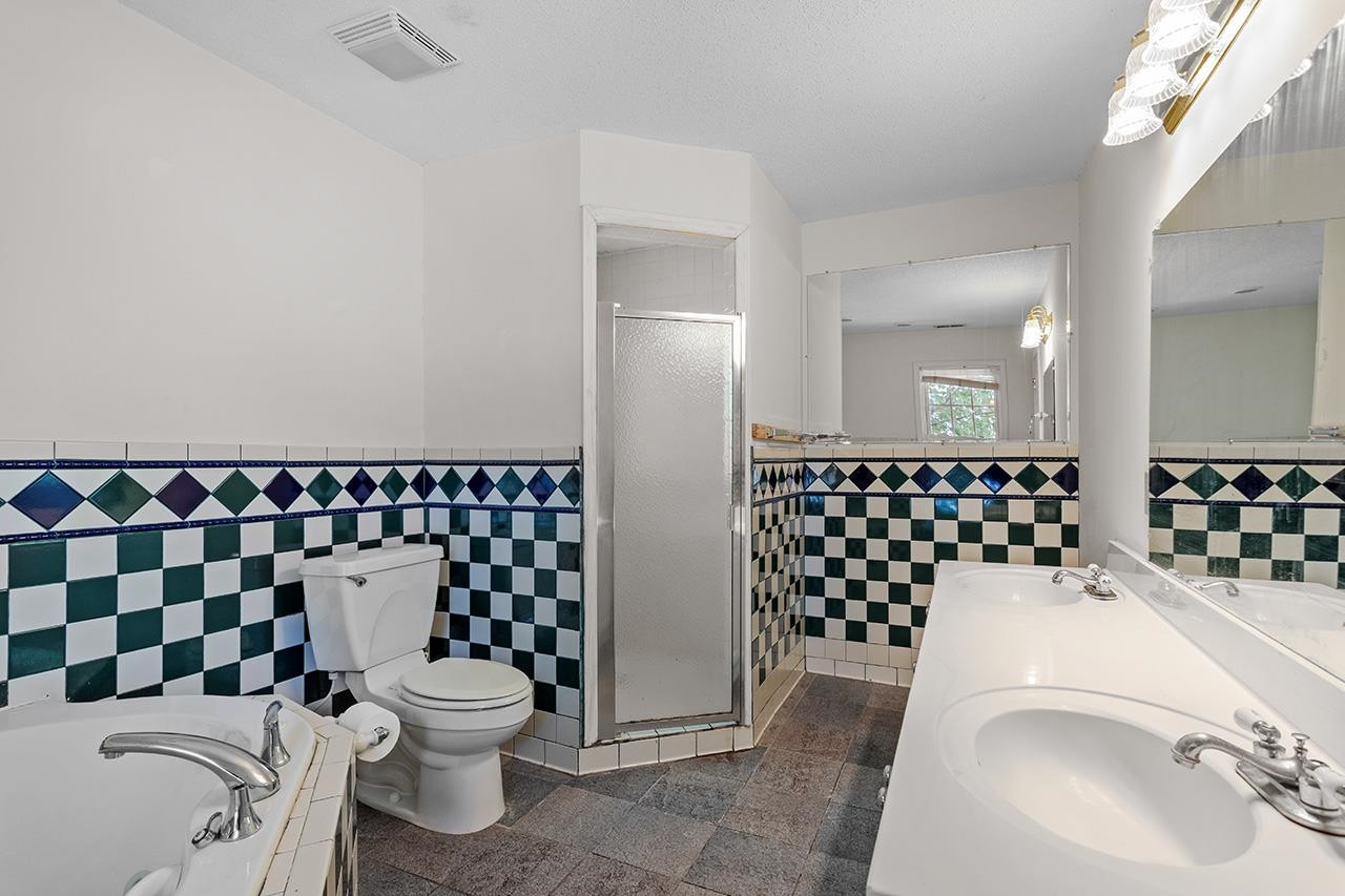 24 Dixie Trail Raleigh, NC 27607 - Photo 33 of 38 a bathroom with a sink toilet and shower