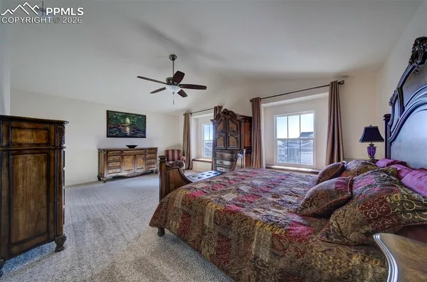 a bedroom with a bed and a television in it