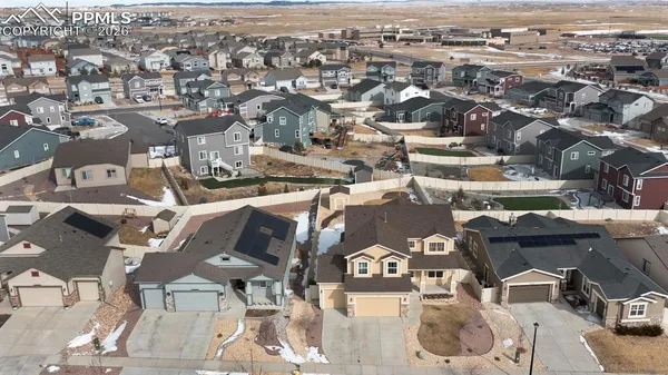 an aerial view of a city with lots of residential buildings
